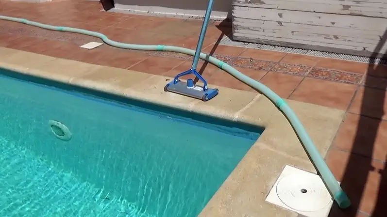 How to get air out of a pool vacuum hose - lay out the hose