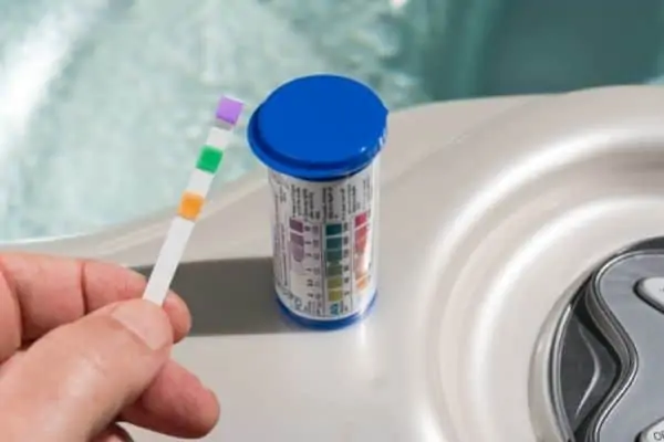 high chlorine in hot tub side effects - use a test strip