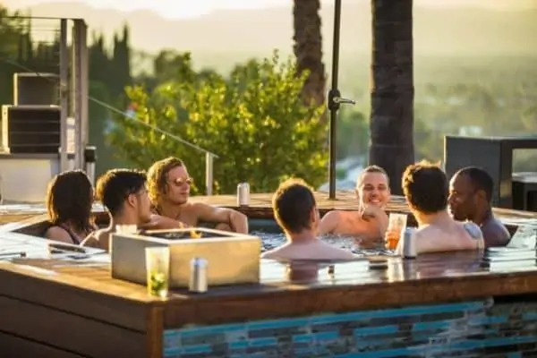 Men siiting in a hot tub perhaps considering the Pros and Cons of a Hot Tub