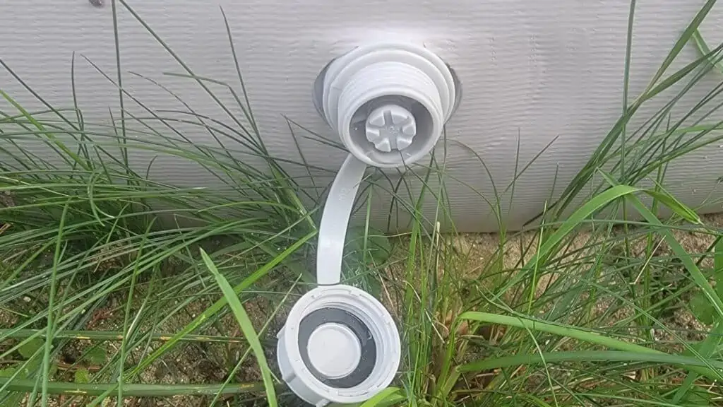 Using a drain plug to drain an above ground pool