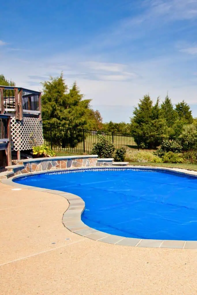 a pool with a blue pool cover