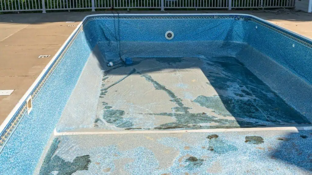 empty damaged vinyl pool